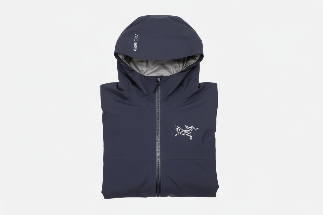Dark Blue Arc'Teryx jacket with hood and zipper. The Arc'teryx logo is on the left front breast.