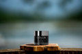 GM Collin Anti Aging Cream sitting on a Sonora Resort piece of wood