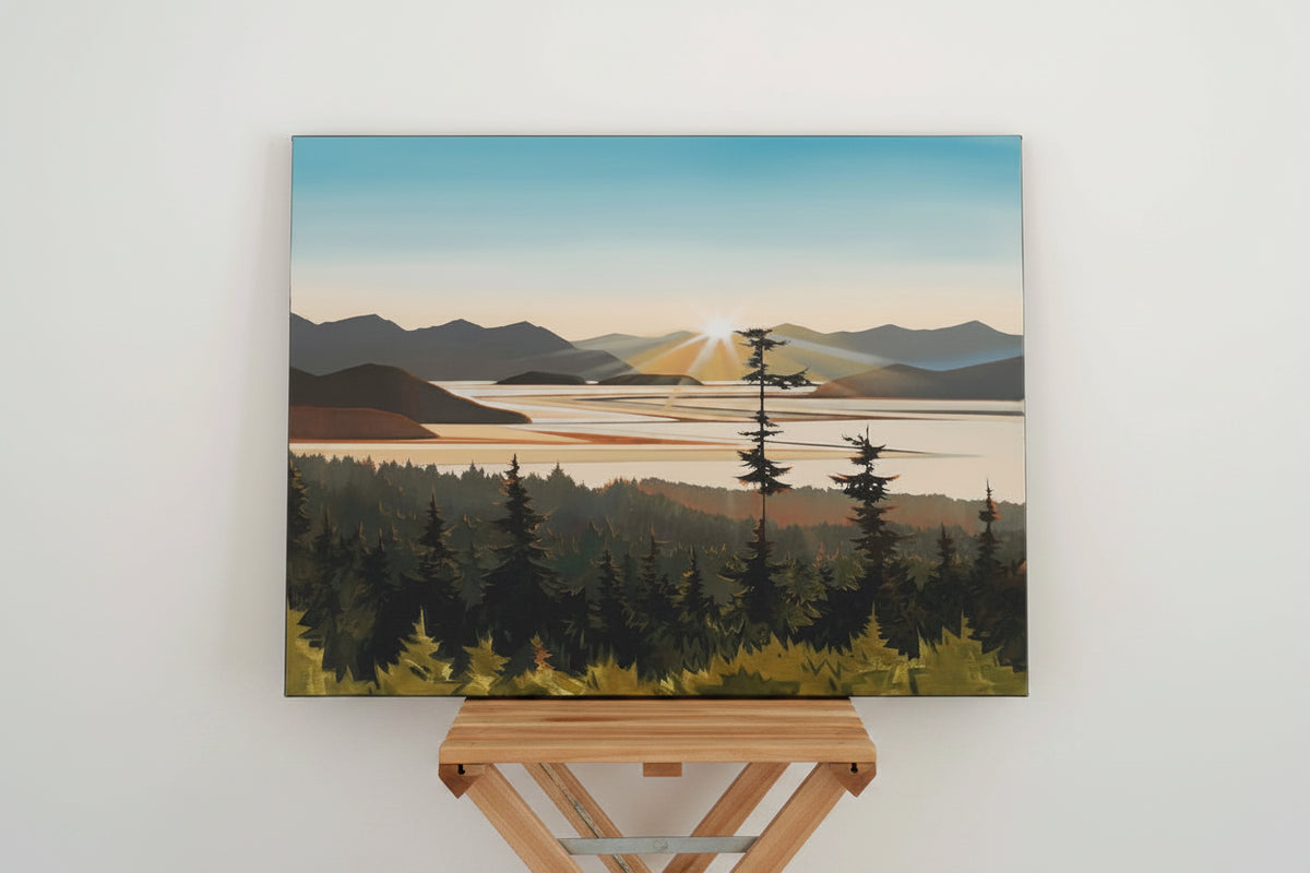 A Fiona Dalrymple landscape painting of the Pacific Northwest with a mountain lake at sunset, displayed on a rustic wooden shelf against a white wall.