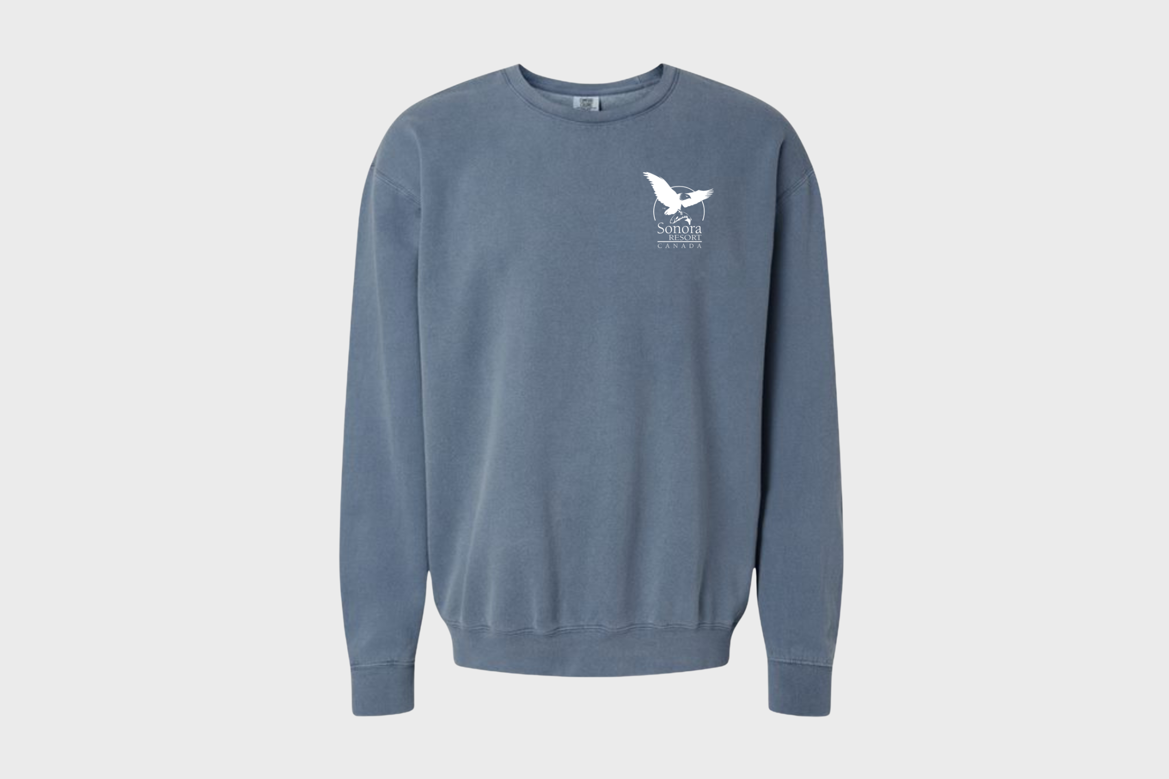 Crewneck sweater with Sonora Resort logo on the top left, in colour 'blue jean', on a white background.