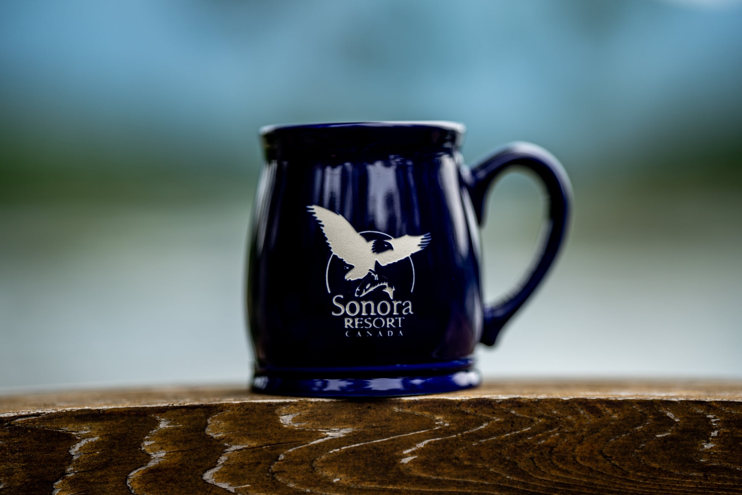Cobalt blue mug etched with the Sonora Resort logo.