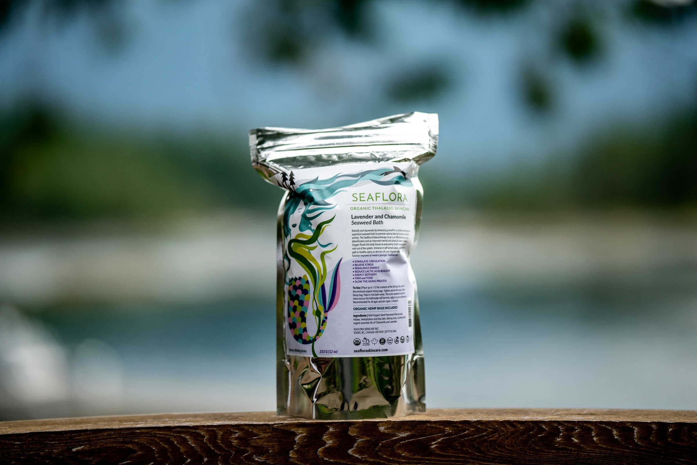 Seaflo product packaging on a wooden surface with a blurred natural background